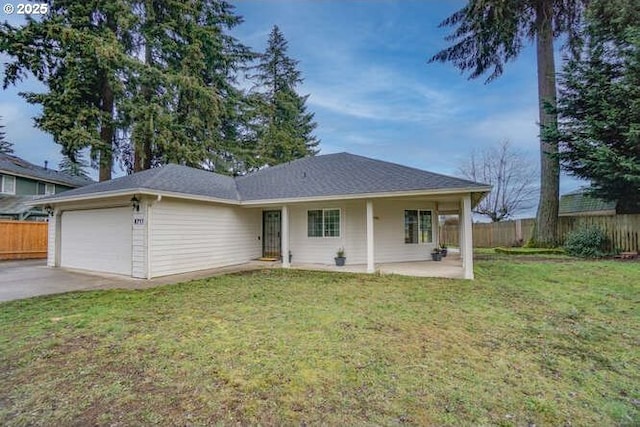 ranch-style home with a front lawn and a garage