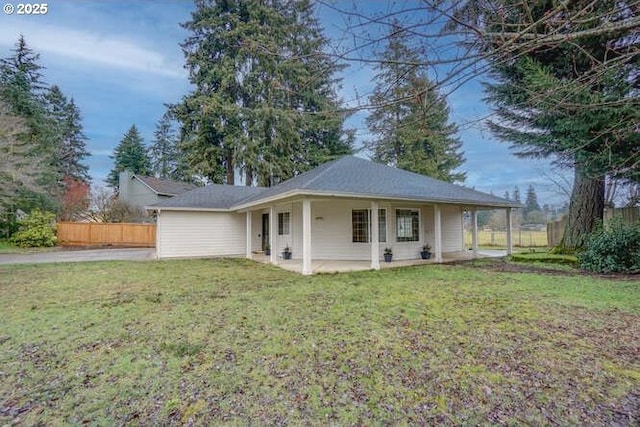 exterior space with a patio and a front lawn