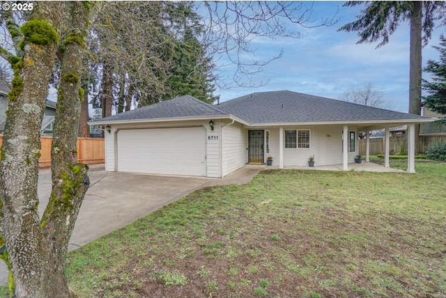 single story home featuring a front lawn and a garage