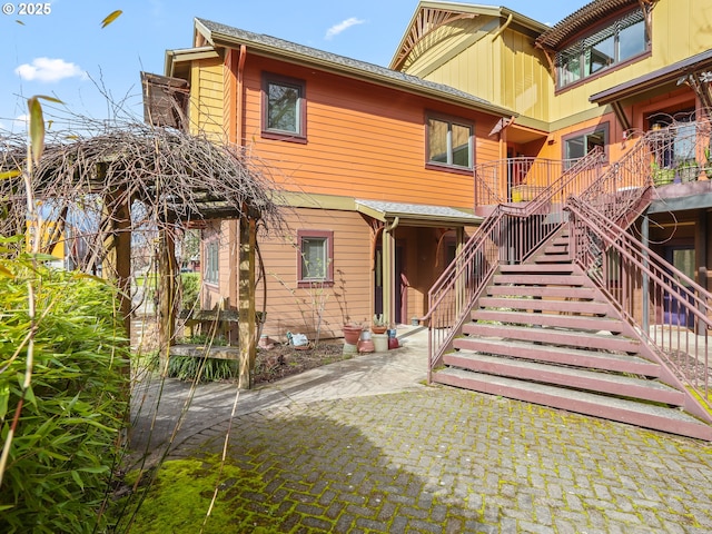 back of property with stairway