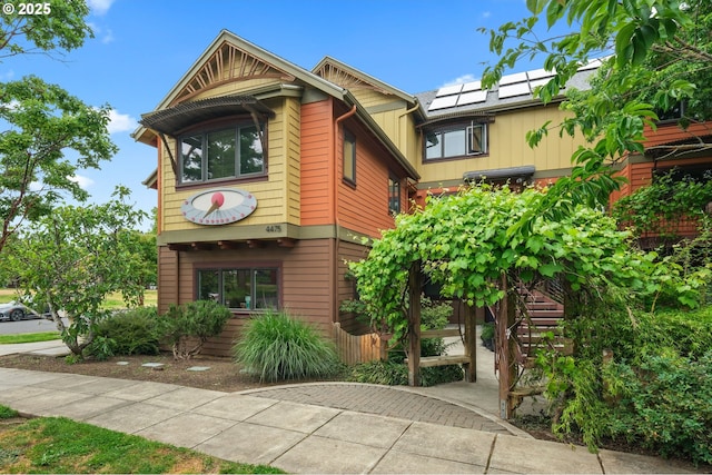 4475 N Trenton St Unit 101, Portland, OR 97203 - view of front facade with solar panels