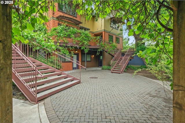 4475 N Trenton St Unit 101, Portland, OR 97203 - view of community featuring stairs, a patio, and a deck