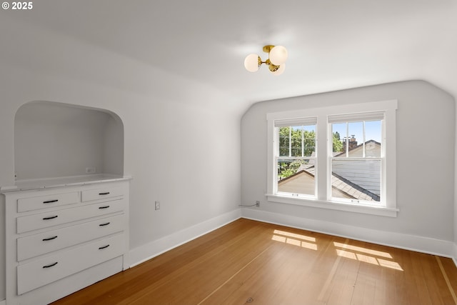 7505 SE 22nd Ave, Portland, OR 97202 - additional living space with baseboards, wood finished floors, and lofted ceiling