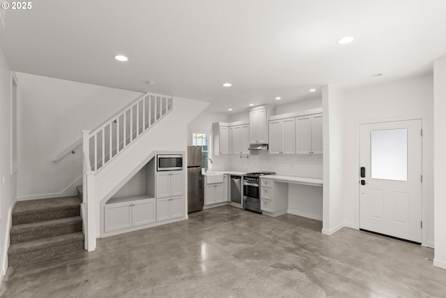 7505 SE 22nd Ave, Portland, OR 97202 - kitchen with stainless steel appliances, finished concrete floors, recessed lighting, tasteful backsplash, and a sink