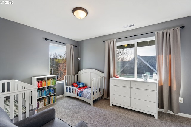 895 SW 170th Ave, Beaverton, OR 97006 - bedroom with carpet flooring, multiple windows, and a crib