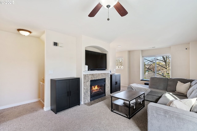 895 SW 170th Ave, Beaverton, OR 97006 - living area featuring ceiling fan, carpet floors, a tiled fireplace, and baseboards