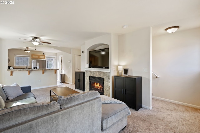 895 SW 170th Ave, Beaverton, OR 97006 - living room featuring a ceiling fan, light colored carpet, baseboards, and a tiled fireplace