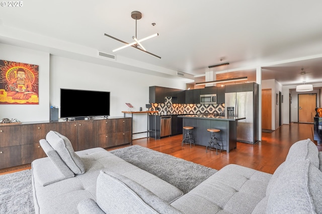 1221 SW 10th Ave Unit 410, Portland, OR 97205 - living room with dark wood finished floors