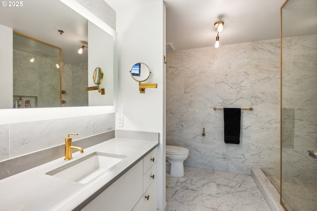 1221 SW 10th Ave Unit 410, Portland, OR 97205 - full bathroom with marble look tile flooring, vanity, toilet, and a marble finish shower