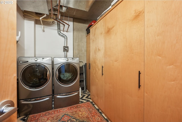 1221 SW 10th Ave Unit 410, Portland, OR 97205 - washroom featuring washer and clothes dryer