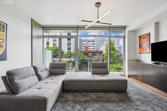 1221 SW 10th Ave Unit 410, Portland, OR 97205 - living room with floor to ceiling windows, plenty of natural light, and wood finished floors