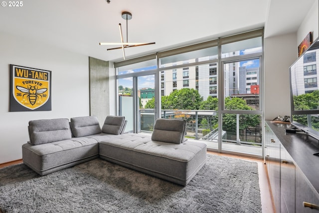 1221 SW 10th Ave Unit 410, Portland, OR 97205 - living room featuring wood finished floors and expansive windows