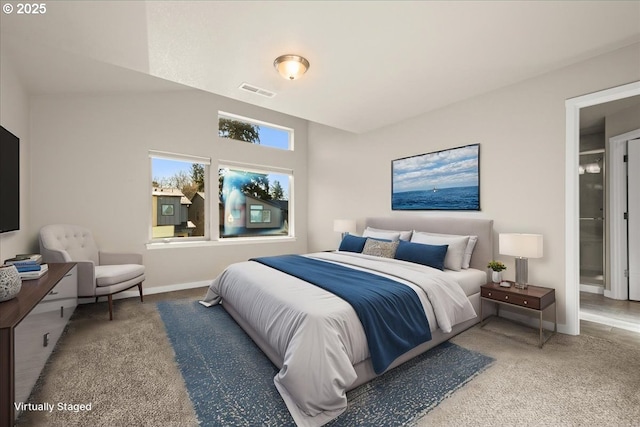 carpeted bedroom featuring baseboards and visible vents