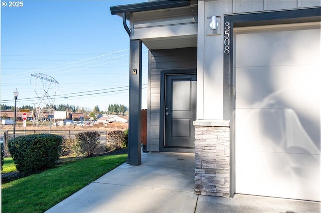 doorway to property featuring stone siding