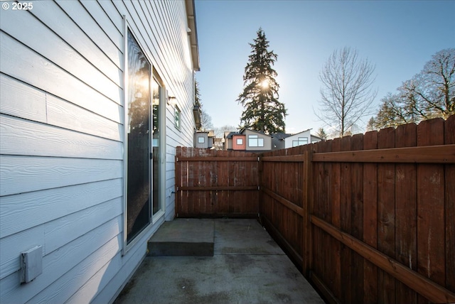 view of patio / terrace featuring fence