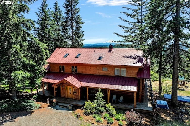 161 Acme Rd, White Salmon, WA 98672 - view of front of house featuring metal roof, a chimney, covered porch, and a mountain view