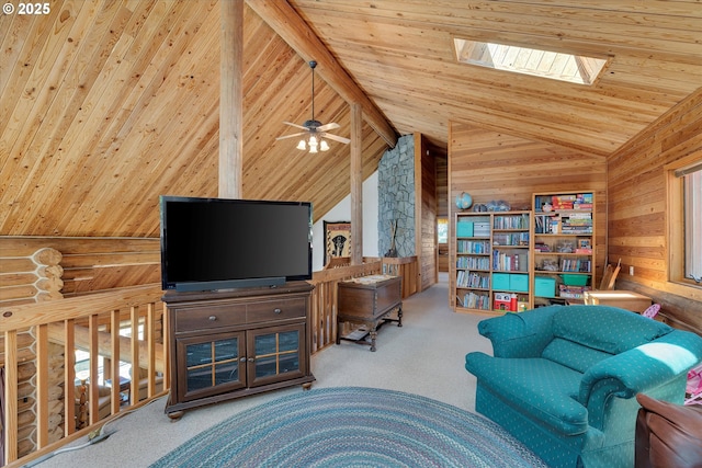 161 Acme Rd, White Salmon, WA 98672 - living area featuring lofted ceiling, carpet flooring, wooden ceiling, a skylight, and wood walls