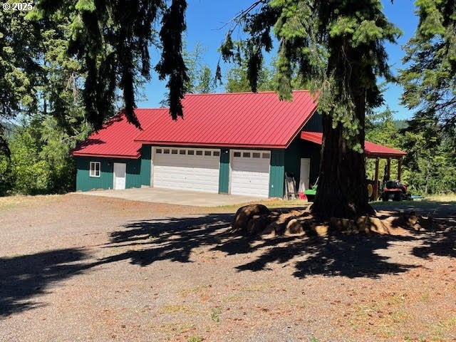 161 Acme Rd, White Salmon, WA 98672 - view of front facade with a garage and metal roof