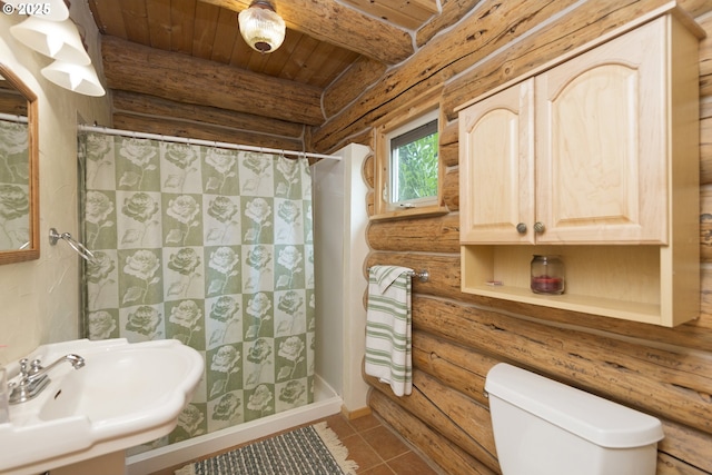 161 Acme Rd, White Salmon, WA 98672 - full bath with rustic walls, a shower stall, toilet, a sink, and tile patterned floors