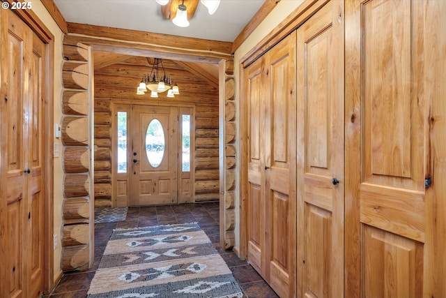 161 Acme Rd, White Salmon, WA 98672 - entryway with rustic walls, a chandelier, and dark stone finish floors