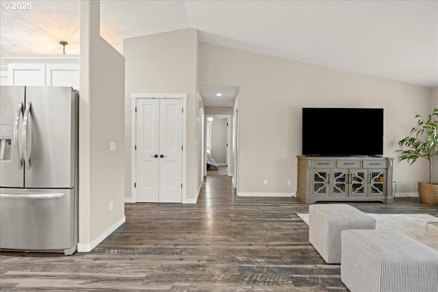 living room with vaulted ceiling and dark hardwood / wood-style flooring