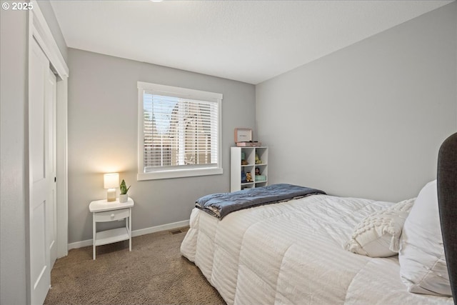 carpeted bedroom with a closet