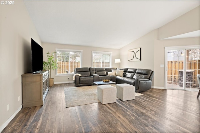 living room featuring lofted ceiling and dark hardwood / wood-style flooring