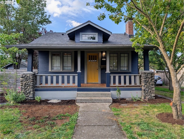 7035 NE Klickitat St NE, Portland, OR 97213 - bungalow featuring covered porch and a chimney