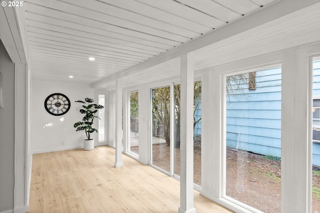 unfurnished sunroom featuring a healthy amount of sunlight