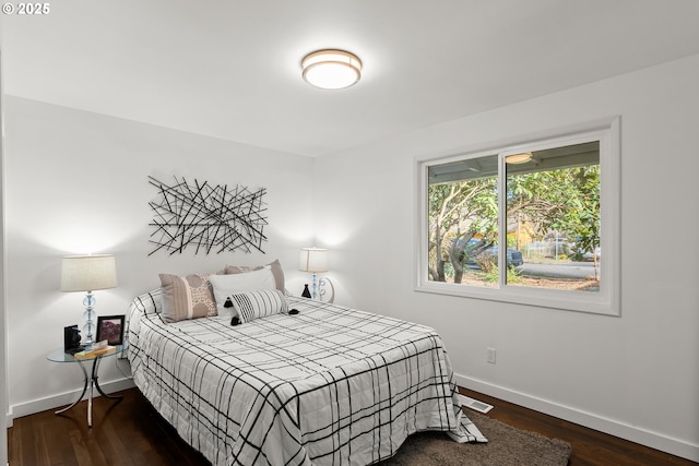 bedroom featuring dark wood-type flooring