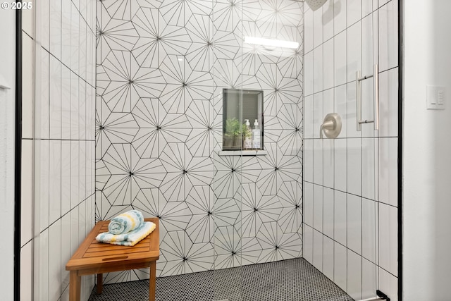 bathroom with tiled shower