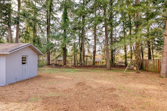 view of yard featuring a storage unit