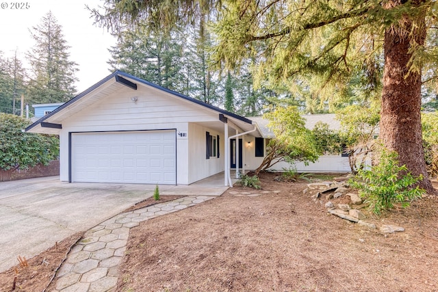 ranch-style home featuring a garage