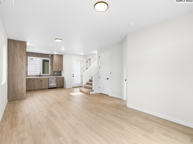 4047 SE 115th Ave, Portland, OR 97266 - unfurnished living room featuring stairway, light wood-style floors, a sink, baseboards, and recessed lighting