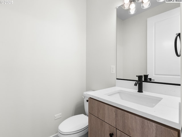 4047 SE 115th Ave, Portland, OR 97266 - bathroom featuring vanity, toilet, and baseboards
