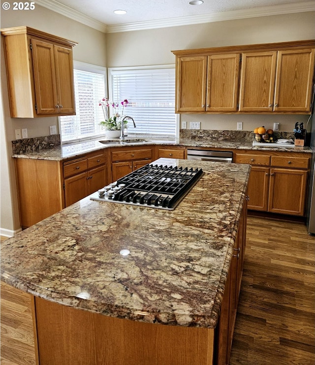 1270 Hidden Creek Dr, Keizer, OR 97303 - kitchen with a sink, appliances with stainless steel finishes, a center island, brown cabinets, and crown molding