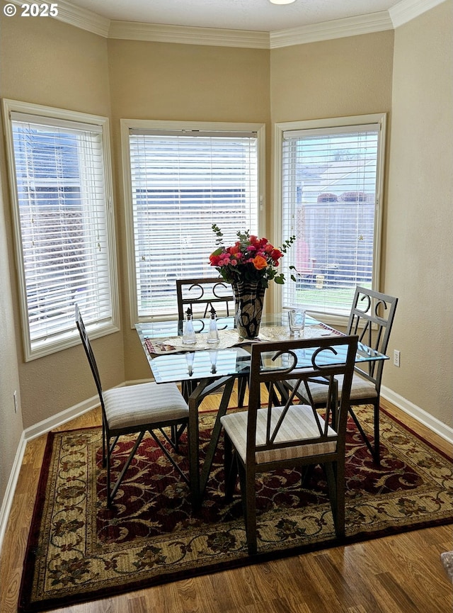 1270 Hidden Creek Dr, Keizer, OR 97303 - dining room featuring baseboards, plenty of natural light, wood finished floors, and crown molding
