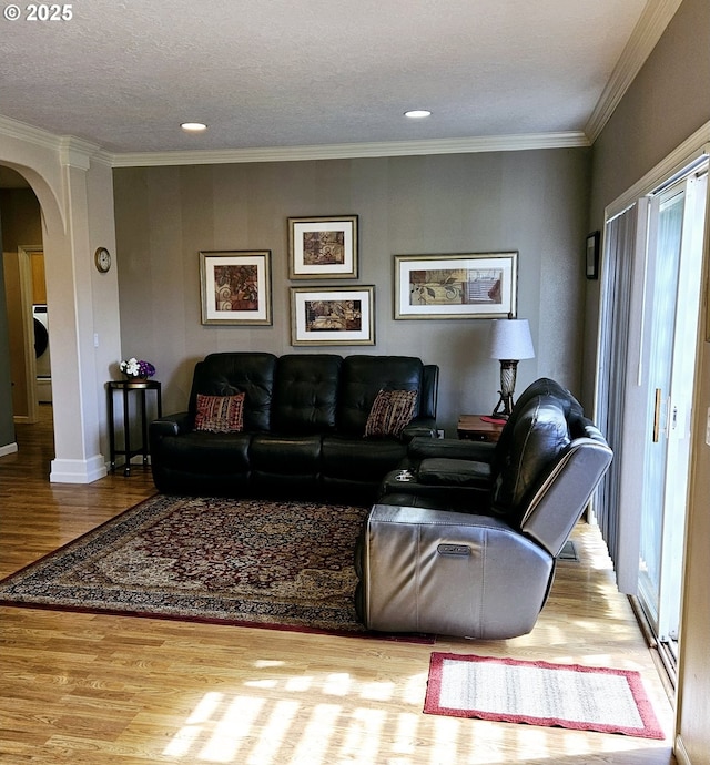 1270 Hidden Creek Dr, Keizer, OR 97303 - living room with arched walkways, wood finished floors, ornamental molding, baseboards, and recessed lighting