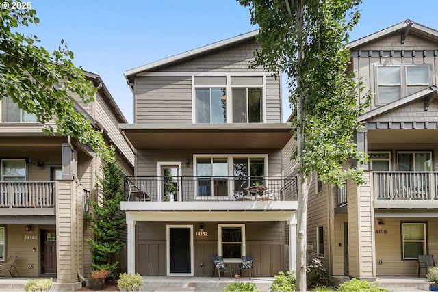 14152 SW Compass Dr, Beaverton, OR 97005 - view of front facade with a balcony and board and batten siding