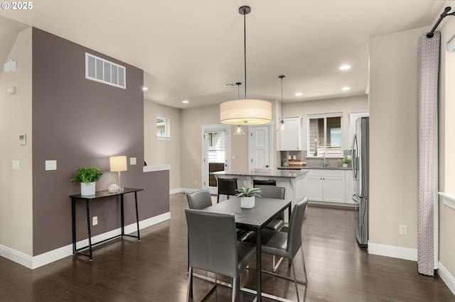 14152 SW Compass Dr, Beaverton, OR 97005 - dining area with recessed lighting and dark wood-style flooring