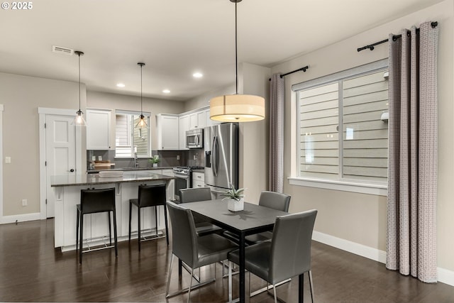 14152 SW Compass Dr, Beaverton, OR 97005 - dining area with recessed lighting and dark wood-style floors