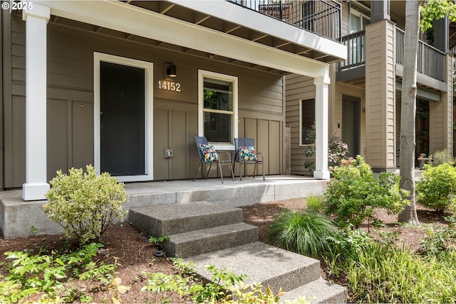 14152 SW Compass Dr, Beaverton, OR 97005 - entrance to property with covered porch, board and batten siding, and a balcony