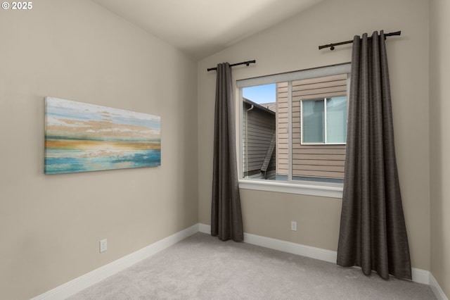 14152 SW Compass Dr, Beaverton, OR 97005 - carpeted empty room featuring lofted ceiling and baseboards