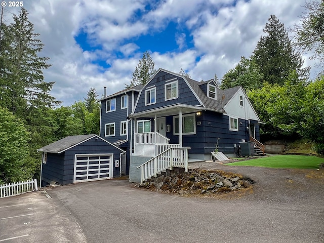 11744 SW 61st Ave, Portland, OR 97219 - dutch colonial featuring a garage, a porch, and asphalt driveway