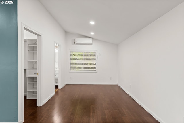 11744 SW 61st Ave, Portland, OR 97219 - unfurnished room with a wall mounted AC, wood finished floors, recessed lighting, and lofted ceiling