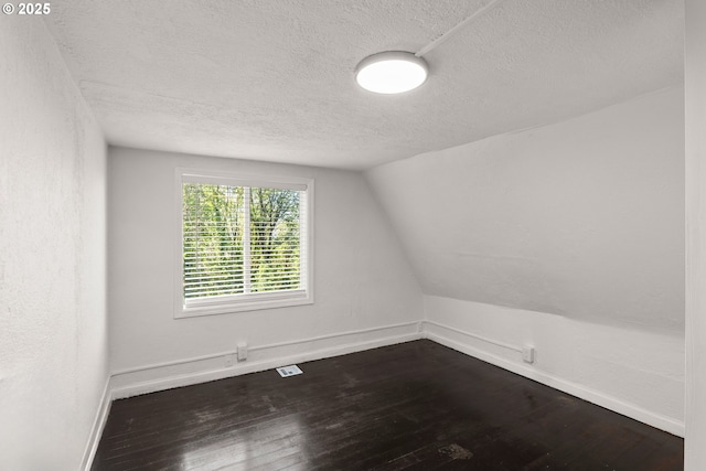 11744 SW 61st Ave, Portland, OR 97219 - bonus room featuring a textured ceiling, dark wood-type flooring, and lofted ceiling