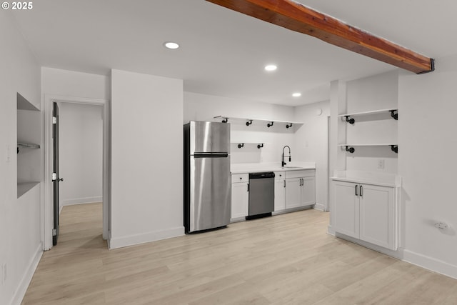 11744 SW 61st Ave, Portland, OR 97219 - kitchen with appliances with stainless steel finishes, open shelves, recessed lighting, light wood finished floors, and light countertops