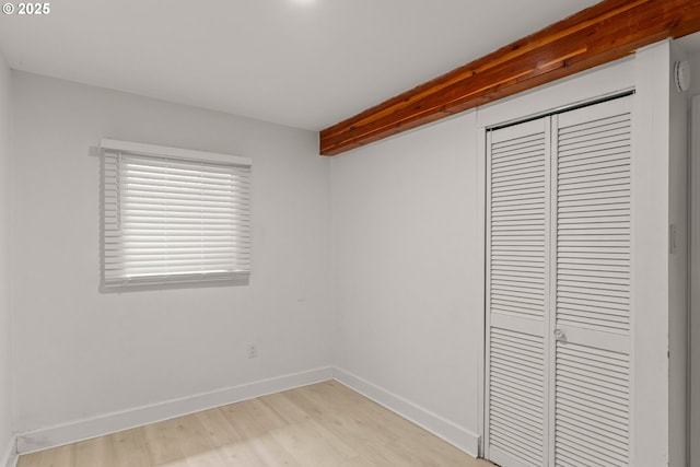 11744 SW 61st Ave, Portland, OR 97219 - unfurnished bedroom with a closet and light wood-style flooring