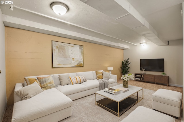 living area featuring carpet