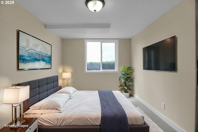 carpeted bedroom with baseboards